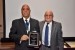 Dr. Nagib Callaos, General Chair, giving Prof. Mohammad Ilyas a plaque "In Appreciation for Delivering a Great Keynote Address at a Plenary Session."